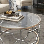 Table basse ronde ouverte chromée et dorée de style moderne